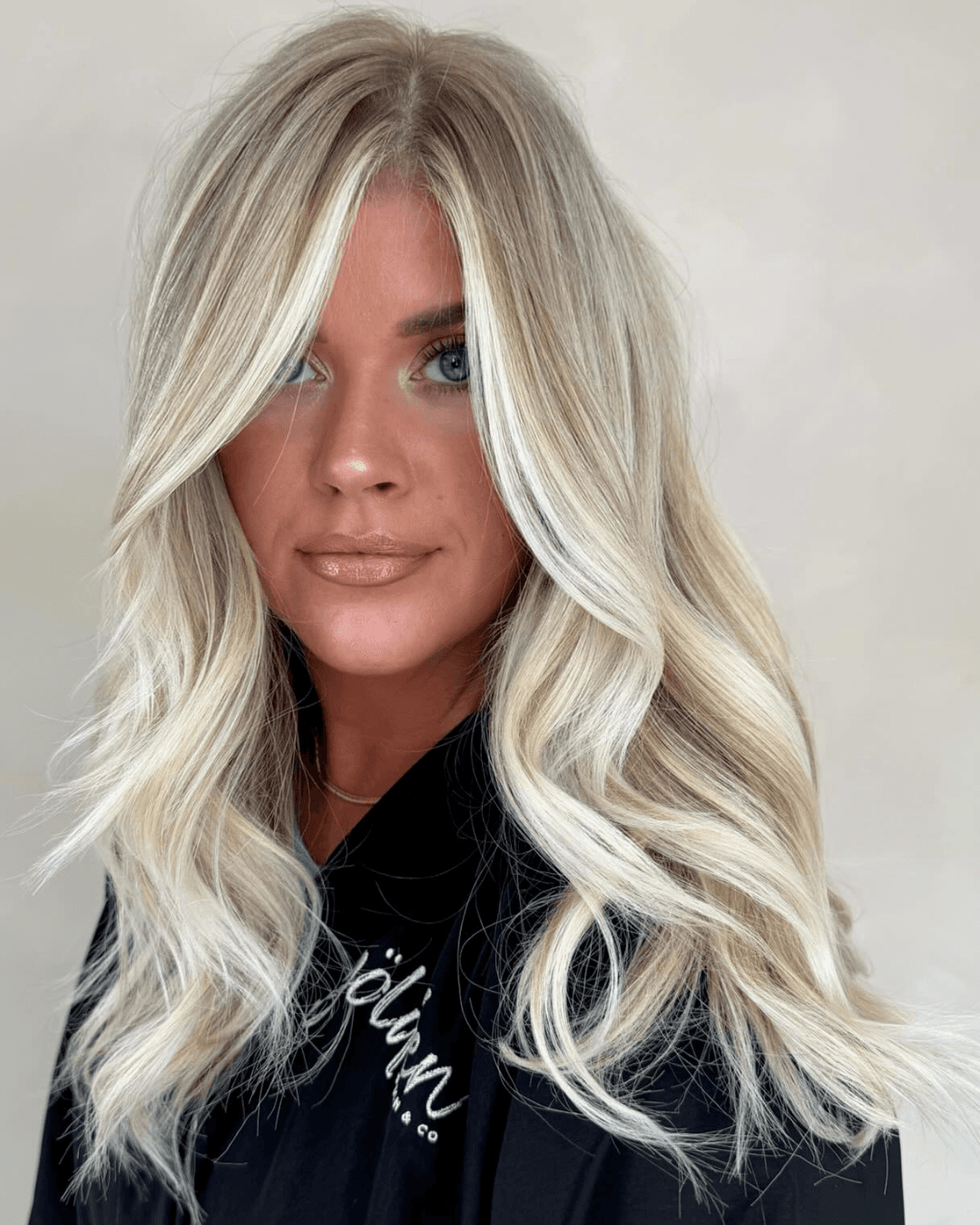coconut blonde medium length curls with dimension Photo Credit Instagram via @ryleeheyzahair